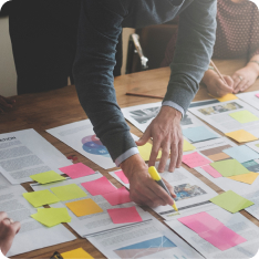 Group of people strategy planning at a desk.